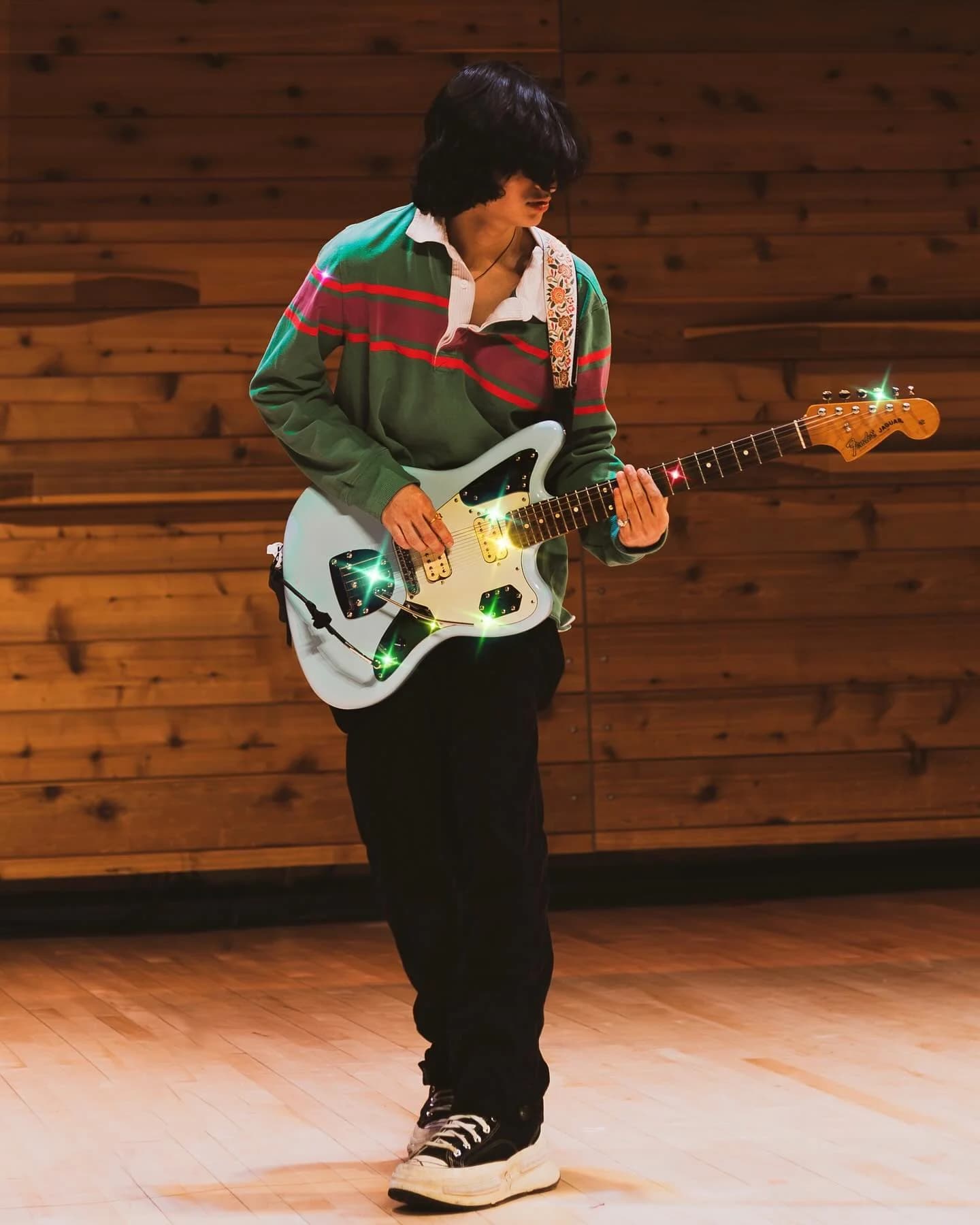 Guitarist portrait with warm stage lighting